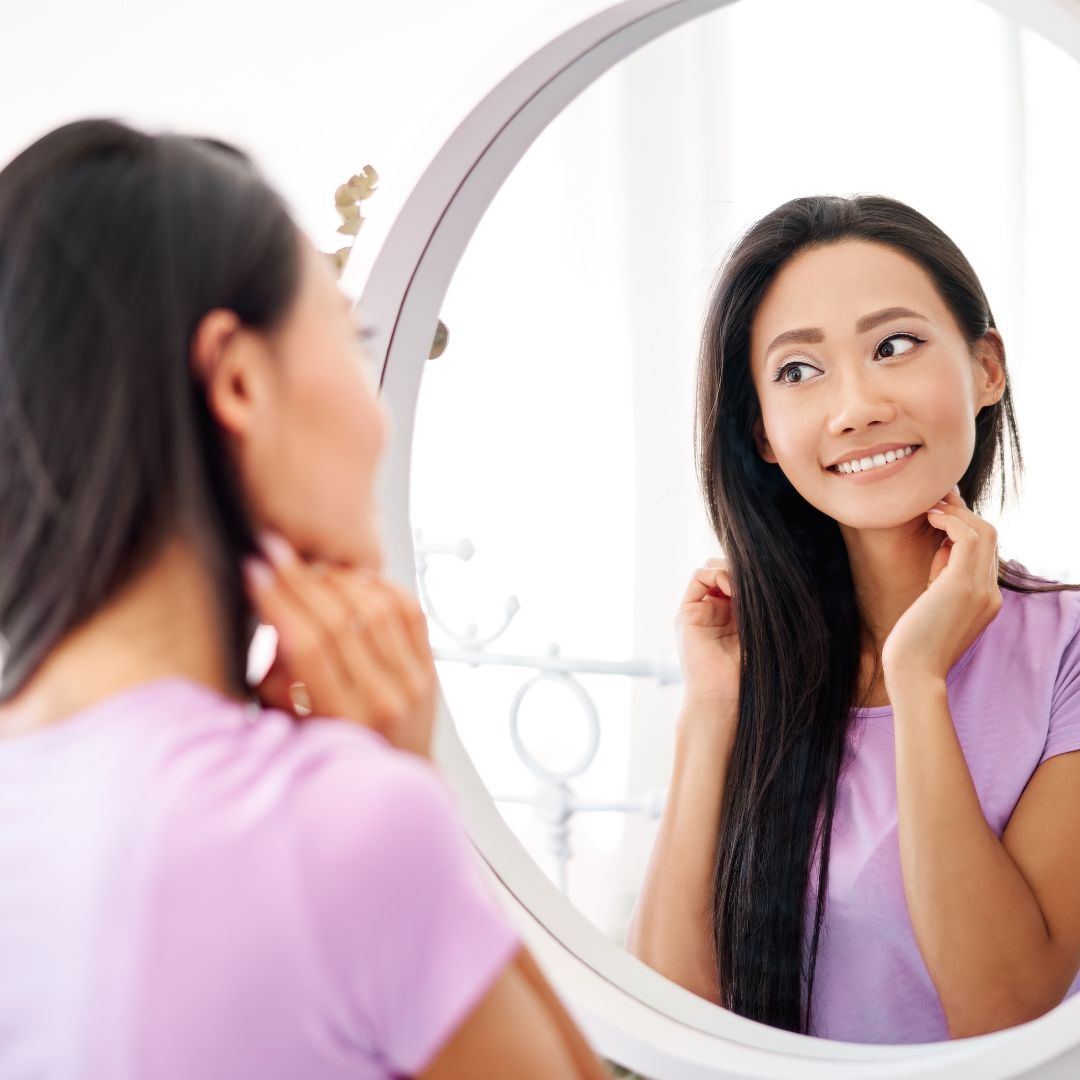 woman looking in a mirror