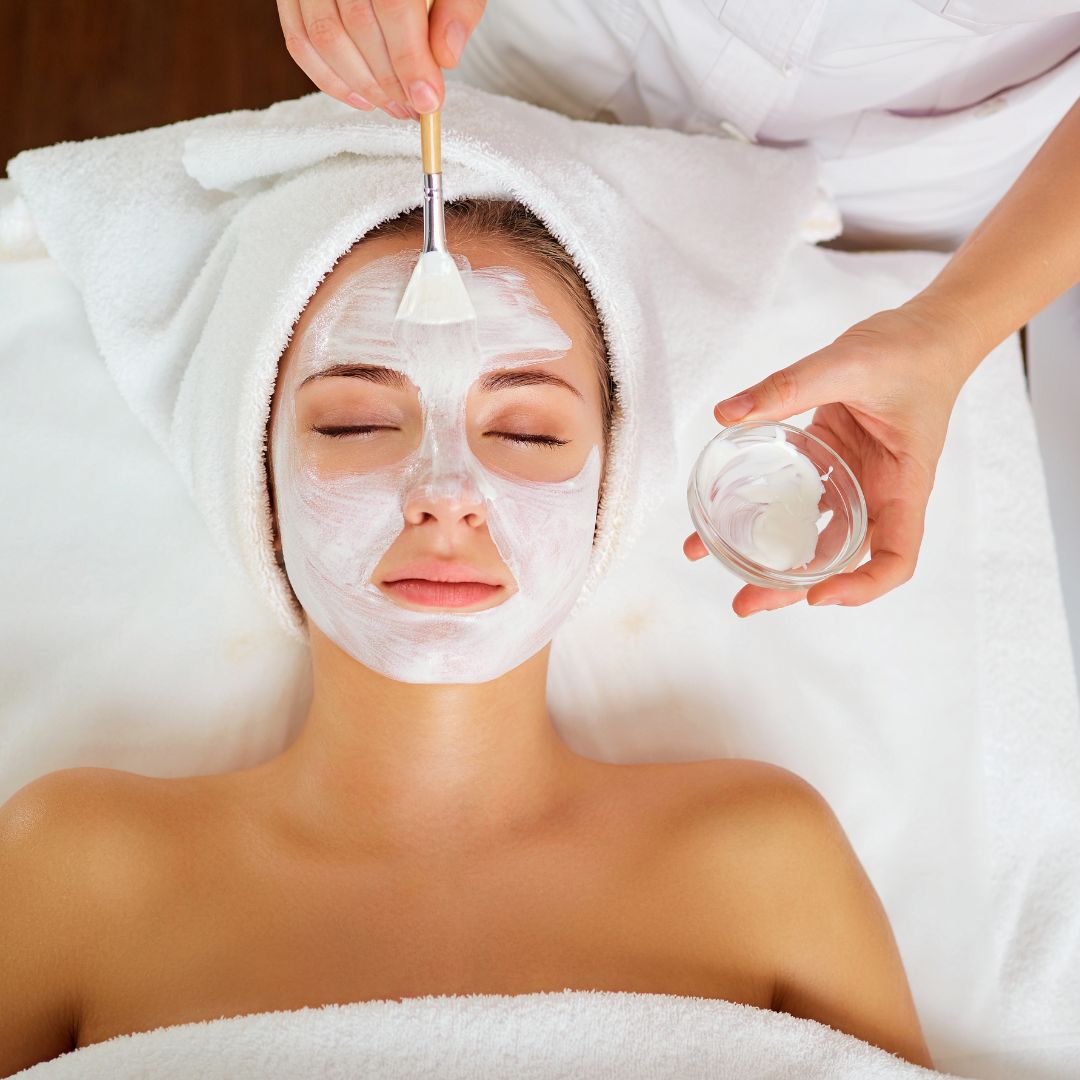 a woman having a facial done