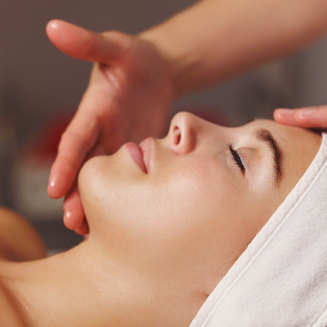 a woman having a facial done